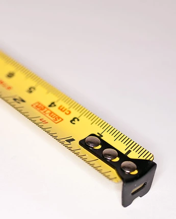 A tape measure used to plan portable fridge fit